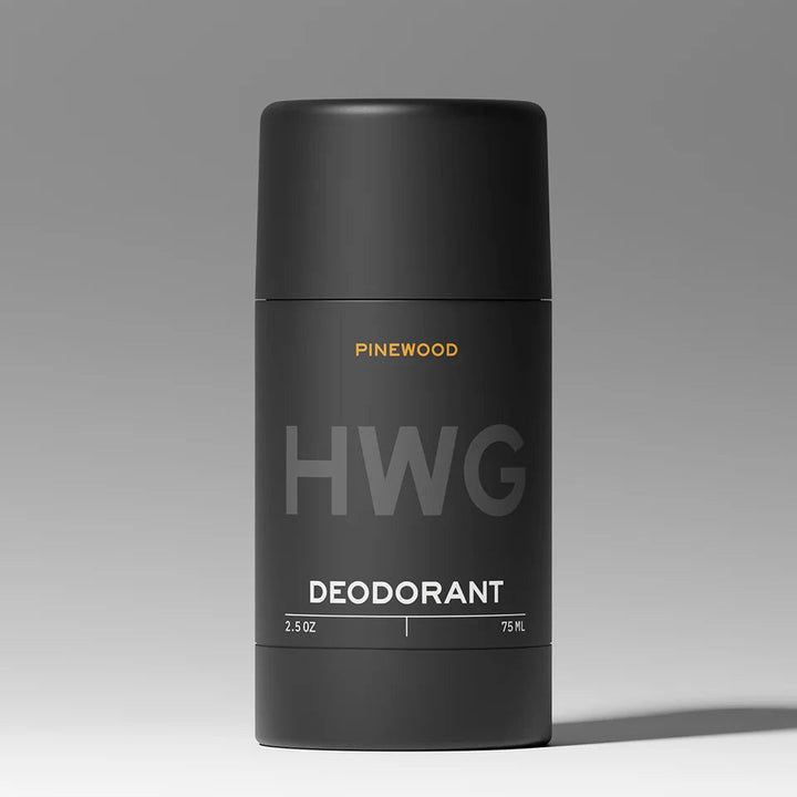 Black deodorant container with 'HWG' and 'Pinewood' branding on a gray background